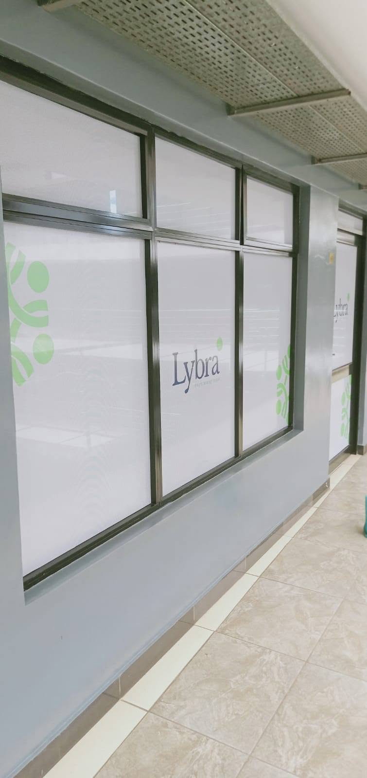 Lybra storefront glass signage
